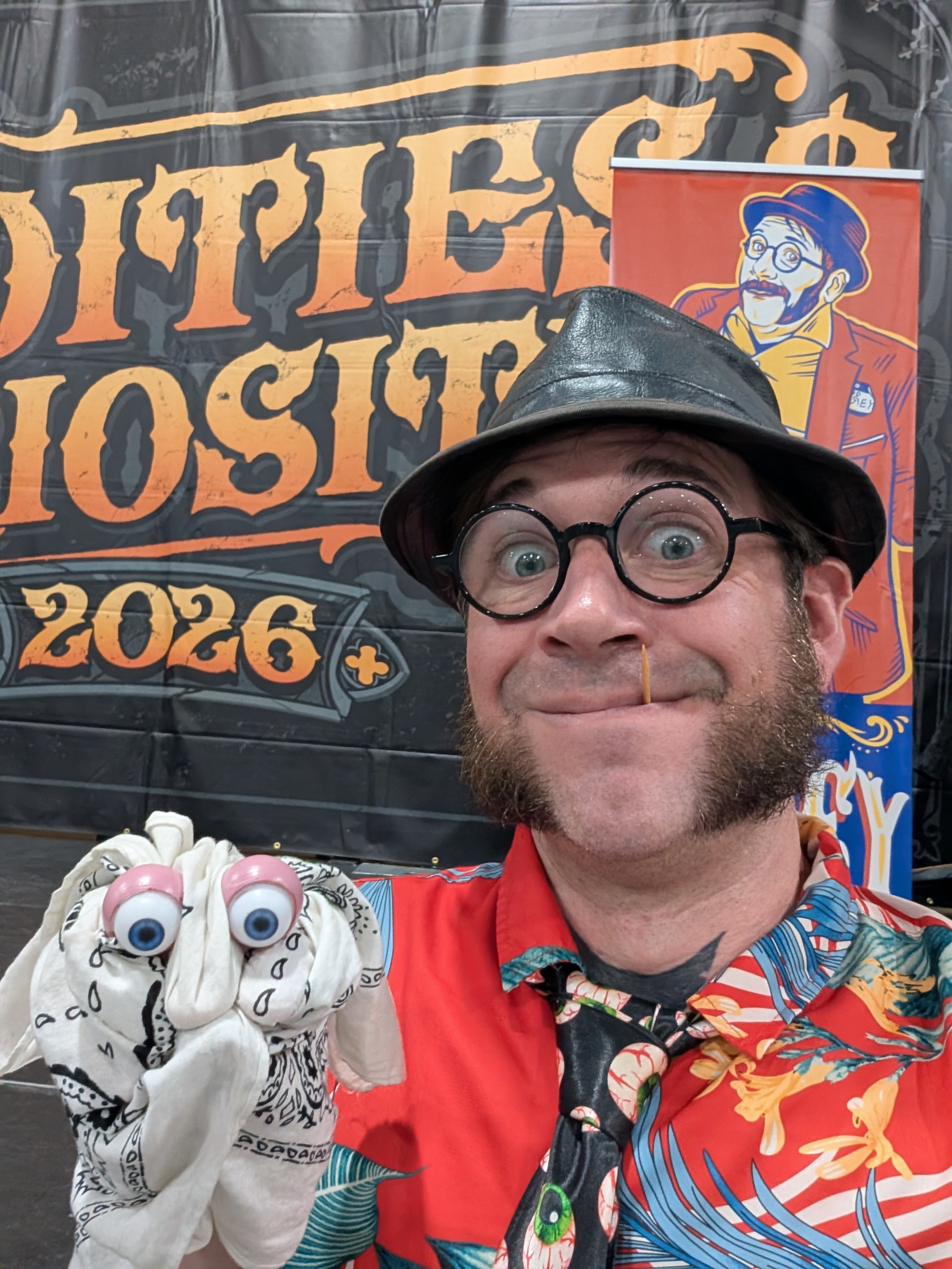 Corey at Oddities Curiosities 2026 with his googly-eye puppet